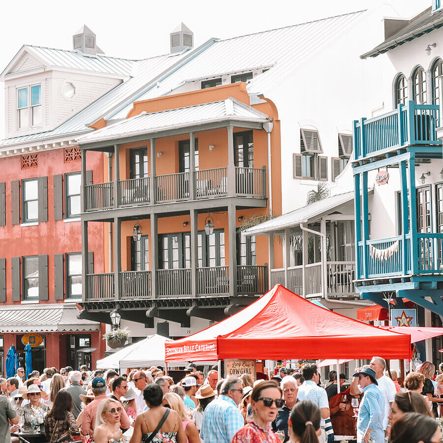 rosemary beach of 30A, rosemary beach uncorked wine, wine festival 30A, beach front couples walking with wine in 30A